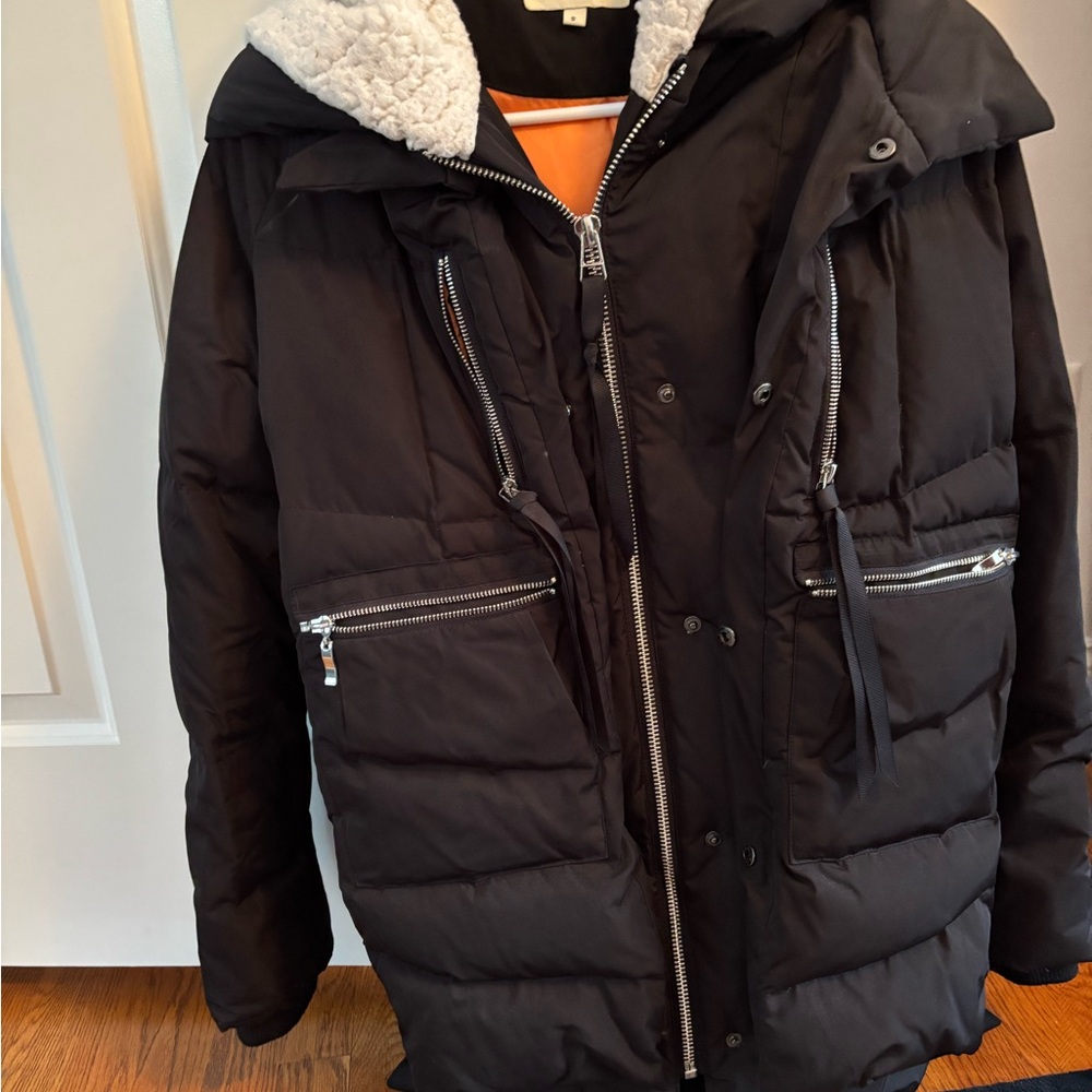 Great coat with loads f pockets and extremely warm. In pristine condition